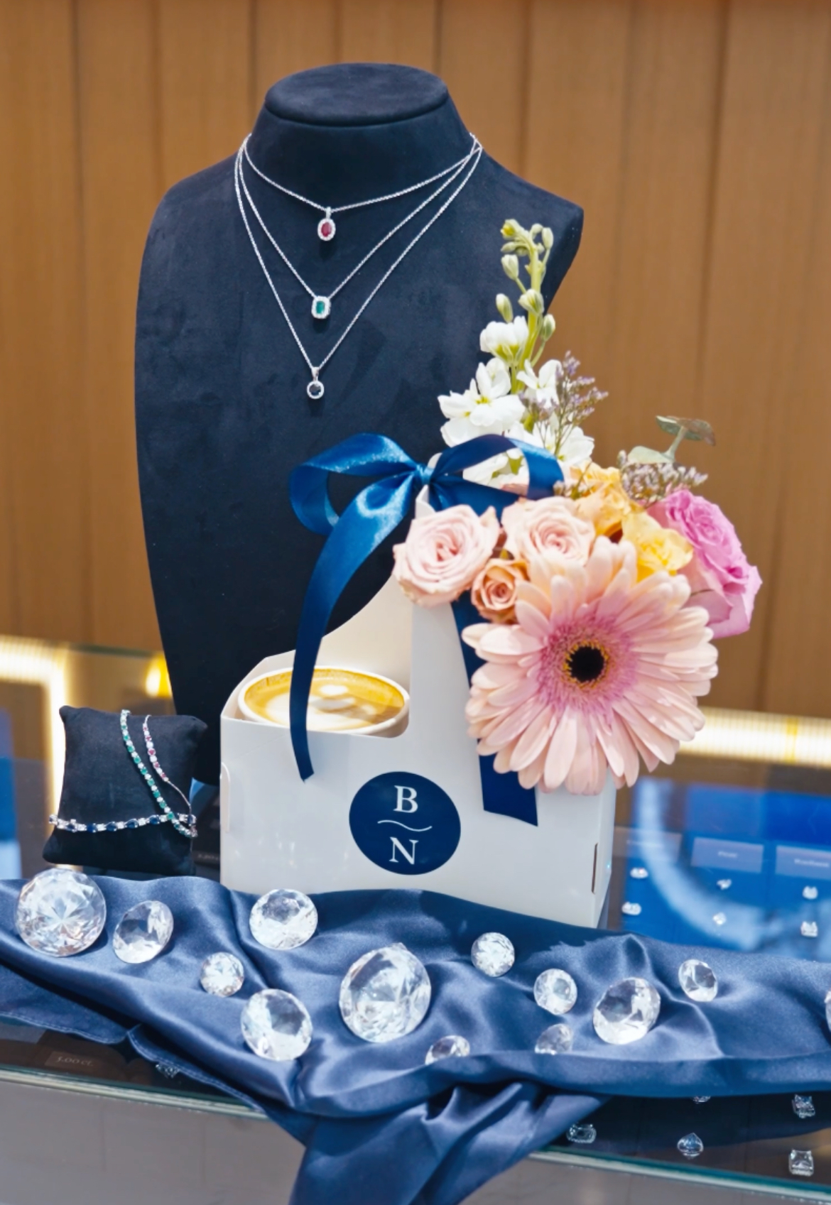 Blue Nile branded flower cart display alongside the Fez Coffee espresso bar at the grand opening