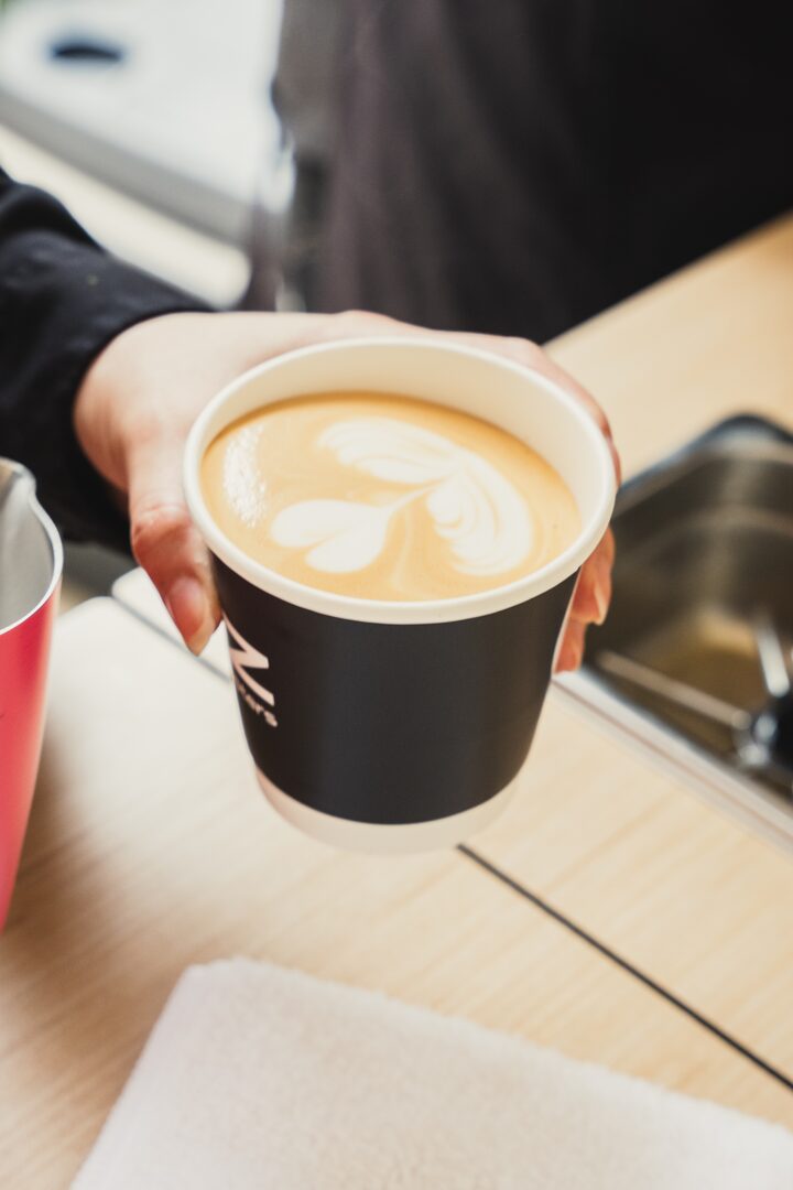 Fez Coffee barista preparing espresso drinks at a branded event in San Francisco.